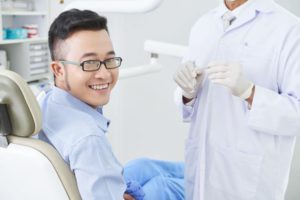 happy asian patient at dentists AGHQC8G 1