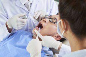 asian man having dental surgery B578XAC